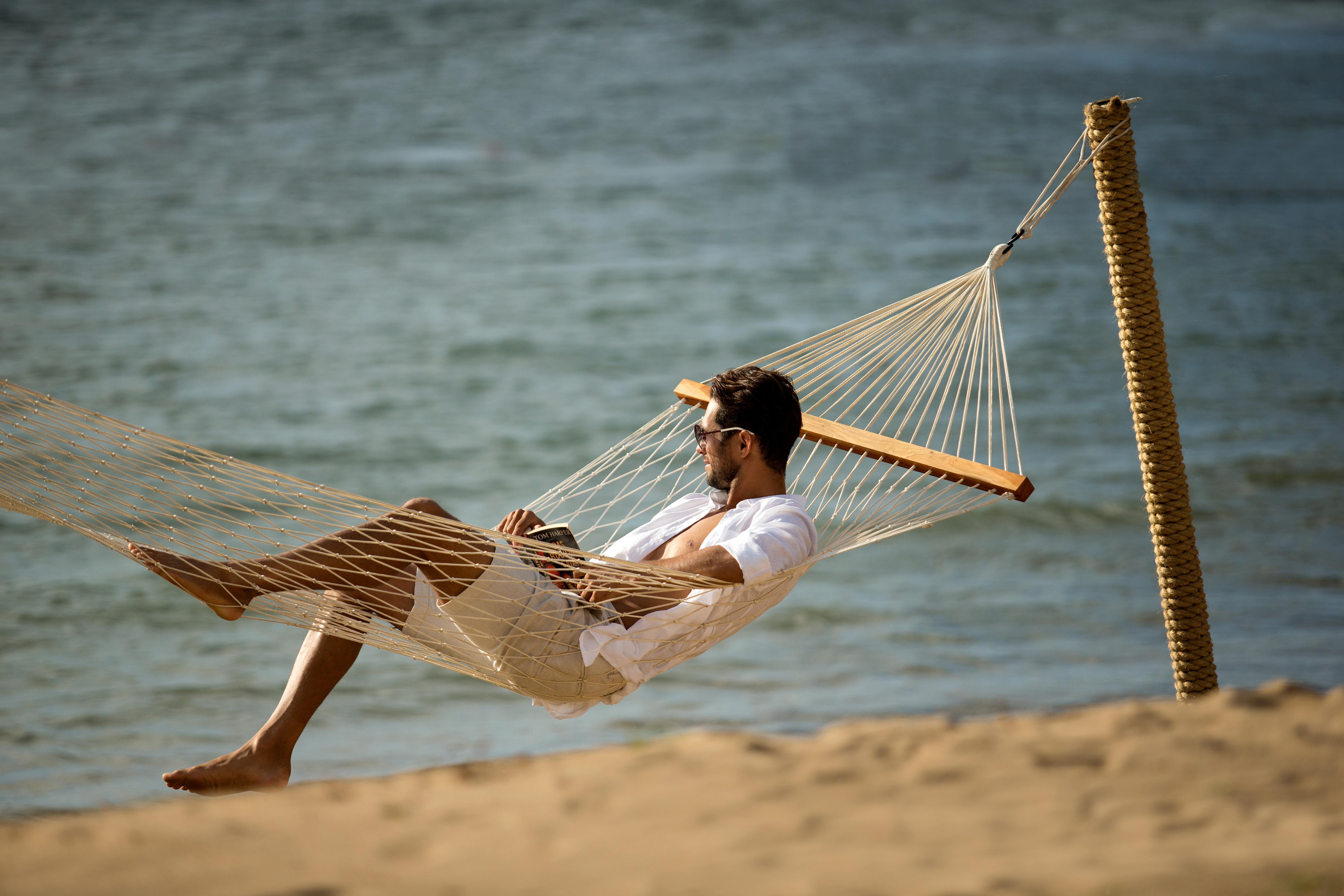 Sadara Resort Nusa Dua  Exterior foto A man relaxing in a hammock